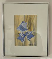 Full view of the framed watercolour painting showing Australian Bluebells with a metallic silver frame and white matting.