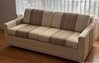 Front view of full sofa showing upholstery and cushion pattern