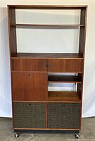 Full front view showing overall design with shelves, doors, and fabric panels on casters.