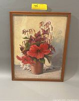 Full view of the framed vintage oil painting depicting a vase with a floral bouquet against a plain background.