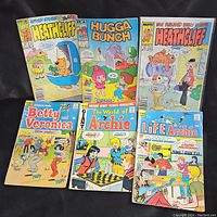 Photo of six vintage comic books with colorful illustrated covers: Heathcliff (two issues), Hugga Bunch, Betty Veronica, Archie Giant Series, Life with Archie.