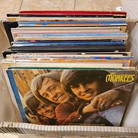View of the assortment of vintage vinyl records showing The Monkees album cover at the front of the box.