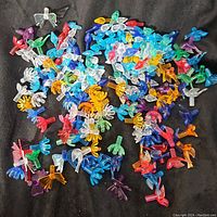 Full spread of various multicolored ceramic peg bulbs showing the mix of shapes and colors.