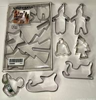 Photo of the IKEA VINTERKUL box and included 6 cookie cutters spread out plus 7 additional cutters including a Mickey Mouse head cutter