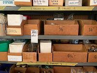 Shelves with boxes labeled as rivets and nuts sorted by size such as 1/4 and 5/16 inch