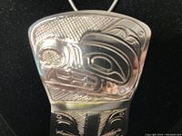 Close-up of front upper section showing Haida formline carving detail