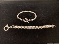 Both bracelets displayed on black background