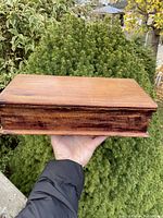 Front and side view of the rectangular pine glove box showing the wood grain and patina.