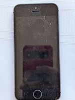 Front view of Apple iPhone SE showing black screen with dust and wear marks.