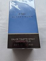 Front lower portion of the box showing volume 3.4 Fl. Oz (100 ml) and Eau de Toilette Spray Vaporisateur