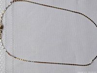 Full view of the chain laid out flat on fabric