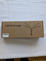 Cardboard box labeled 'LED Grow Light' showing packaging of the product.
