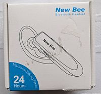 Front of box showing New Bee brand Bluetooth headset illustration and 24-hour talk time feature.