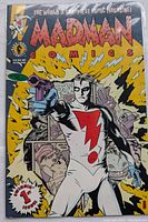 Front cover of Madman comic issue #1 showing character with a gun and red lightning bolt on costume.