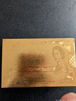 Gold leaf embossed box with Canada $1000 banknote design