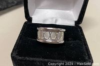 925 sterling silver wide band ring with Roman numeral cutout design, displayed in black velvet jewelry box.