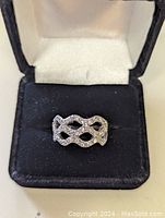 Inset photo of the sterling silver ring in black jewelry box