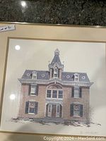 Framed and matted pen and ink print of an old Victorian-style brick house with detailed architectural features, signed by Walter Campbell.