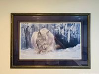 Full view of large framed Robert Bateman Lynx print on a wall showing overall condition and framing.