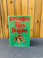 Front cover of the book showing the title 'The Eyes of the Dragon' by Stephen King with dragon illustration.