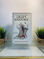 Front cover of 'The Classic Collectors Edition Gray's Anatomy' medical book showing anatomical illustration of neck and head with colorful arteries and veins. Text states 780 illustrations with 172 in color.