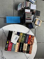 Photo showing assorted classical music CD box sets and individual CDs piled together on a table with visible brand and titles.