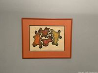 Full view of framed abstract painting on wall