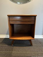 Front view showing drawer and open shelf