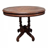 Full view of antique Victorian oval parlor table showing the tabletop and pedestal base