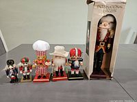 Photo showing all six nutcrackers including the tall international soldier in original box
