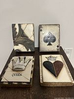 Overview of all four decorative tiles displayed on table