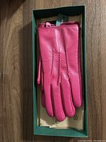 Pink lambskin gloves with stitched detailing on back, still with tags inside green Simons box with tissue paper.