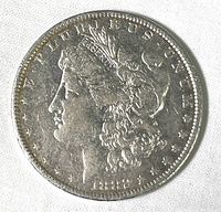 Obverse side of 1882-O Morgan Silver Dollar coin showing Lady Liberty profile and inscriptions including date 1882.