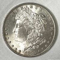 Obverse view of 1883-O Morgan Silver Dollar showing Liberty head, date 1883, and inscriptions.