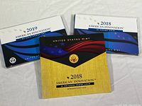 Three sets: 2018 American Innovation $1 Reverse Proof, 2019 and 2018 American Innovation $1 Coin Proof Sets in their original folders.