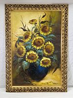 Full frontal view of the painting featuring a sunflower bouquet in an ornate gold painted frame.