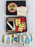 Box with Nuclear War label and several cards including propaganda and population cards laid out around it.