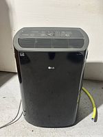 Front view of black LG PuriCare dehumidifier showing digital panel
