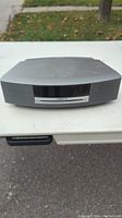 Front view of Bose Wave Music System showing brand logo and speaker grill design.