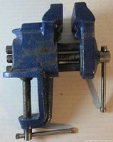 Front and side view of blue Wilton 3-inch bench vise showing clamp base and handle mechanisms.