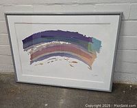 Framed serigraph showing abstract multicolor curved bands in purple, blue, and brown hues, within white mat and silver frame.