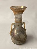 Front angled view of the Roman glass amphora vase showing the funnel rim, taper neck with applied handles.