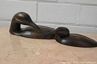 Photo showing the full view of the wooden carvings of the parent and child loons.