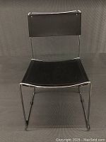 Front view showing tubular chrome frame and leather seat/backrest