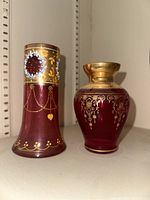 Both Murano glass vases showing height and detailed designs