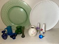 Full lot showing large white and green platters, various vases, mushroom-shaped art glass, and blue fish figurine