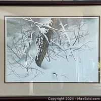 Full view of the framed winter scene print showing snow-covered tree and branches.