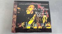 Front cover of the box set showing cover photo of Bob Marley singing, text 'The A to Zion of Reggae Music', 'we be jammin'', and 'Dejavu Retro Gold Collection'