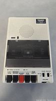 Front top view of TANDY CCR-82 with control buttons and cassette door with printed instructions.