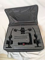 Carrying case opened showing foam inserts custom fitted to gimbal components